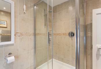 Step into the walk-in shower for a refreshing rinse after a coastal hike.
