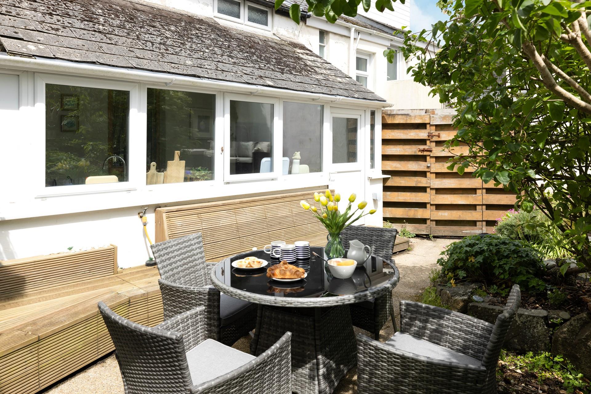 Enjoy breakfast al fresco in the quaint garden. 