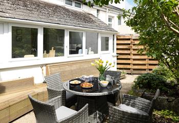 Enjoy breakfast al fresco in the quaint garden. 
