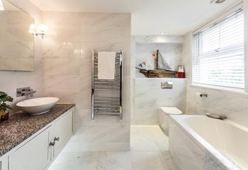 Stylish and modern, the bathroom provides a space to relax and unwind after busy days.