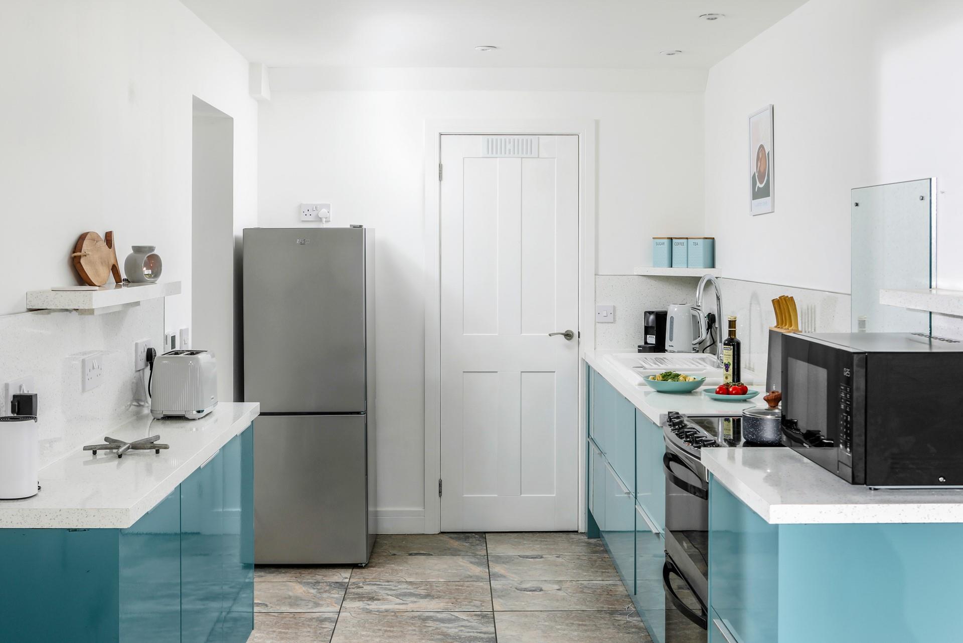 Modern and sleek, the kitchen has all you need to cook up a storm.