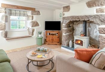 The second sitting room has a cosy woodburner for cooler evenings.