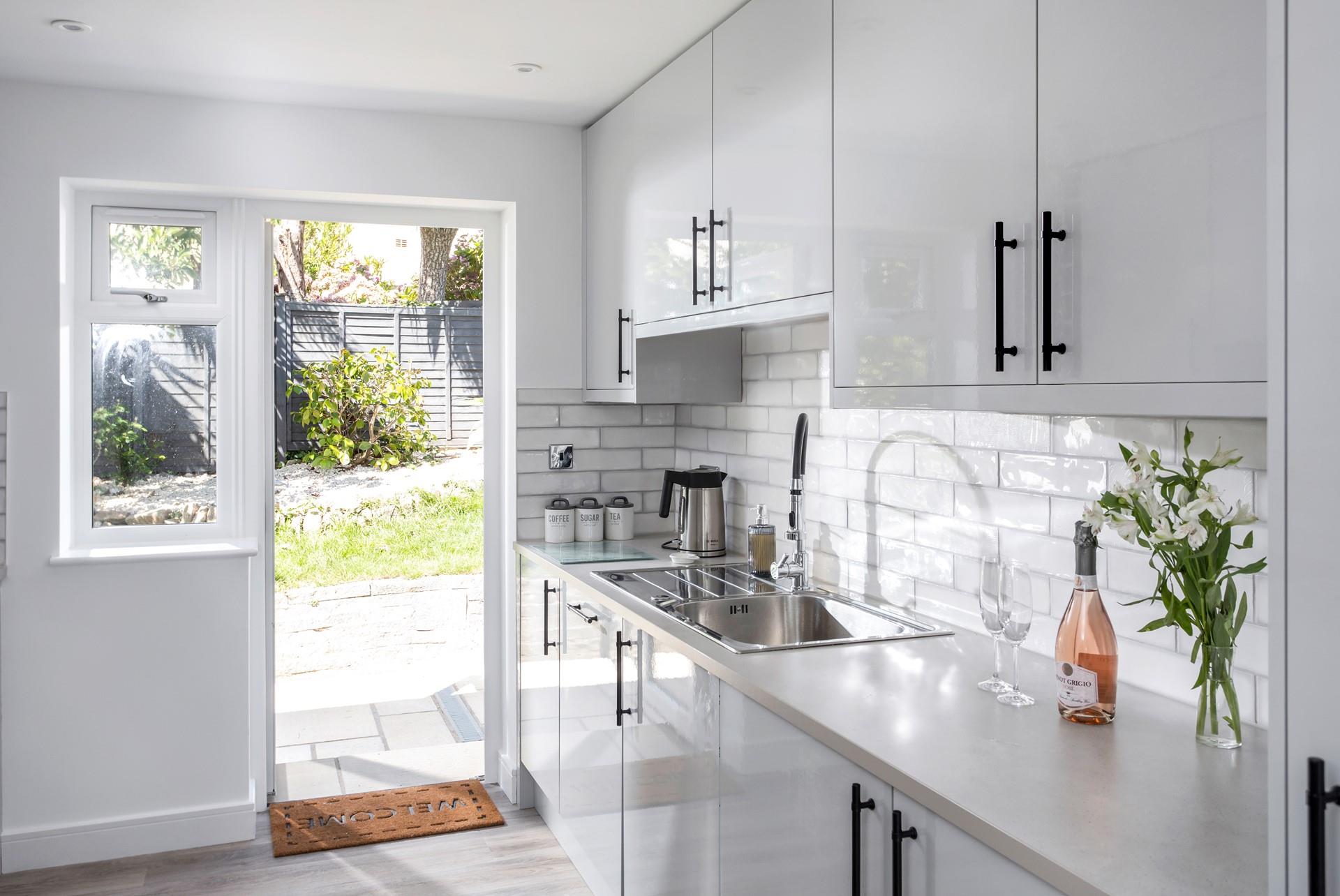 Step from the kitchen into the sunny garden.