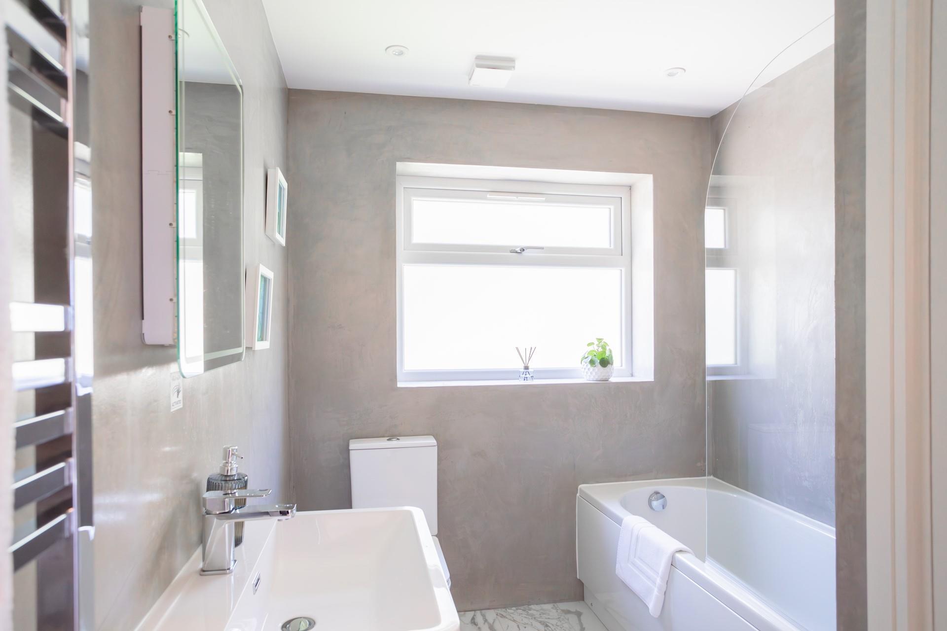 Walk the coast path and rejuvenate with a soak in the spa-like bathroom.