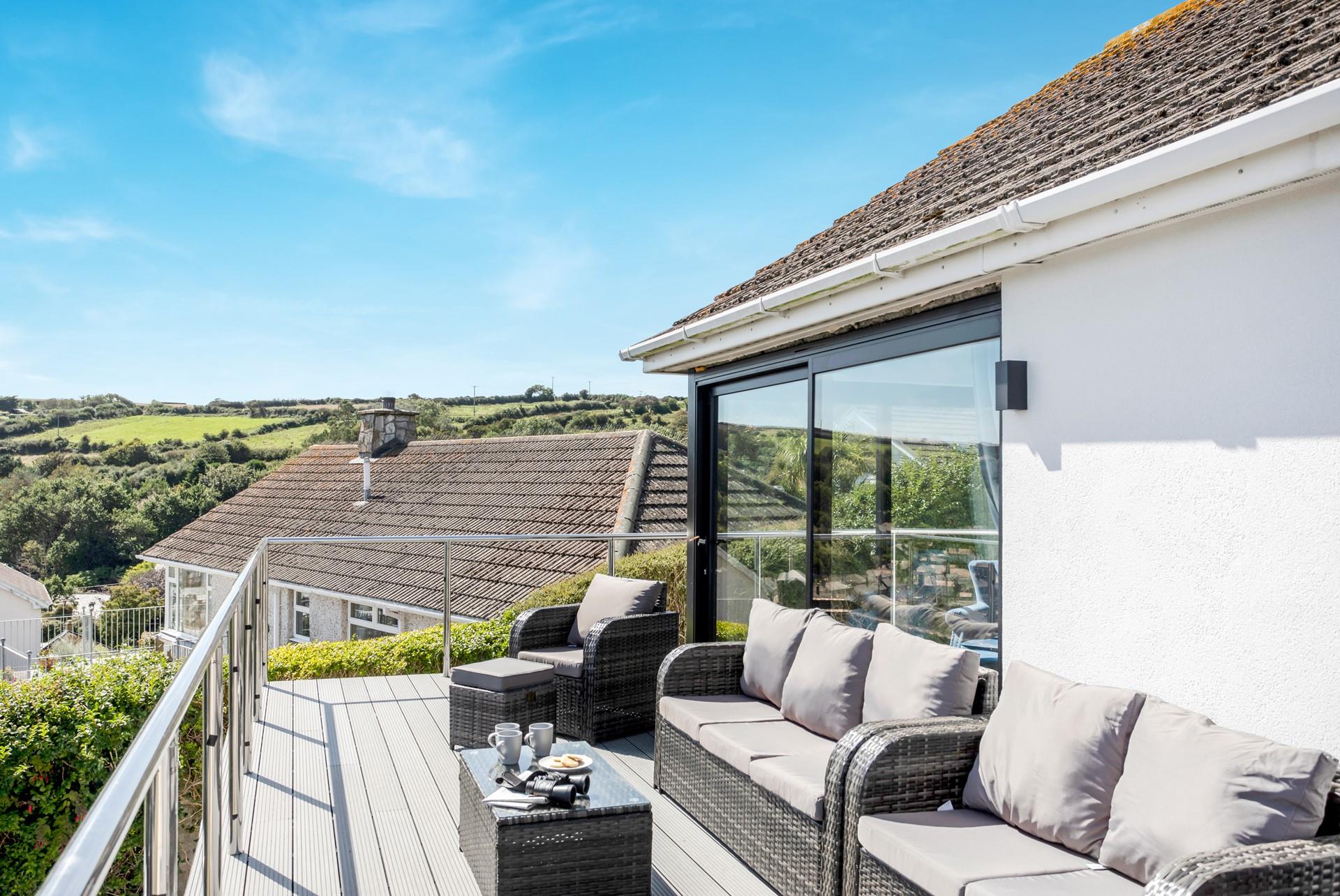 The Cornish coastline meets rolling green fields in beautiful Mousehole.