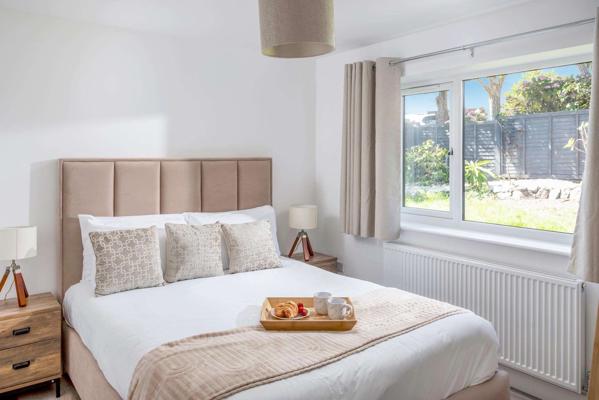 Calming neutral tones create a tranquil bedroom for a good night's sleep.