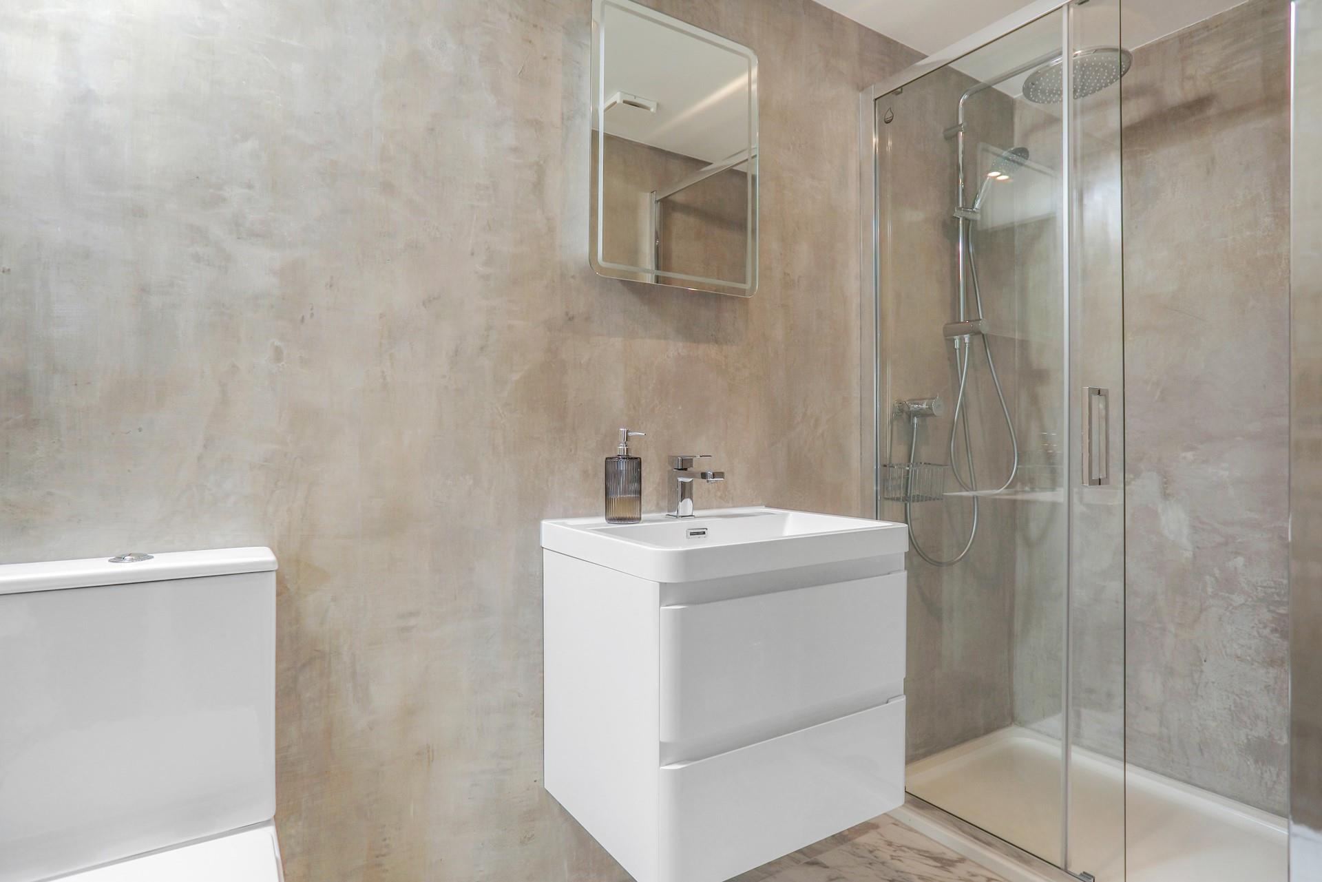 Wash off sandy toes under the rainhead shower.