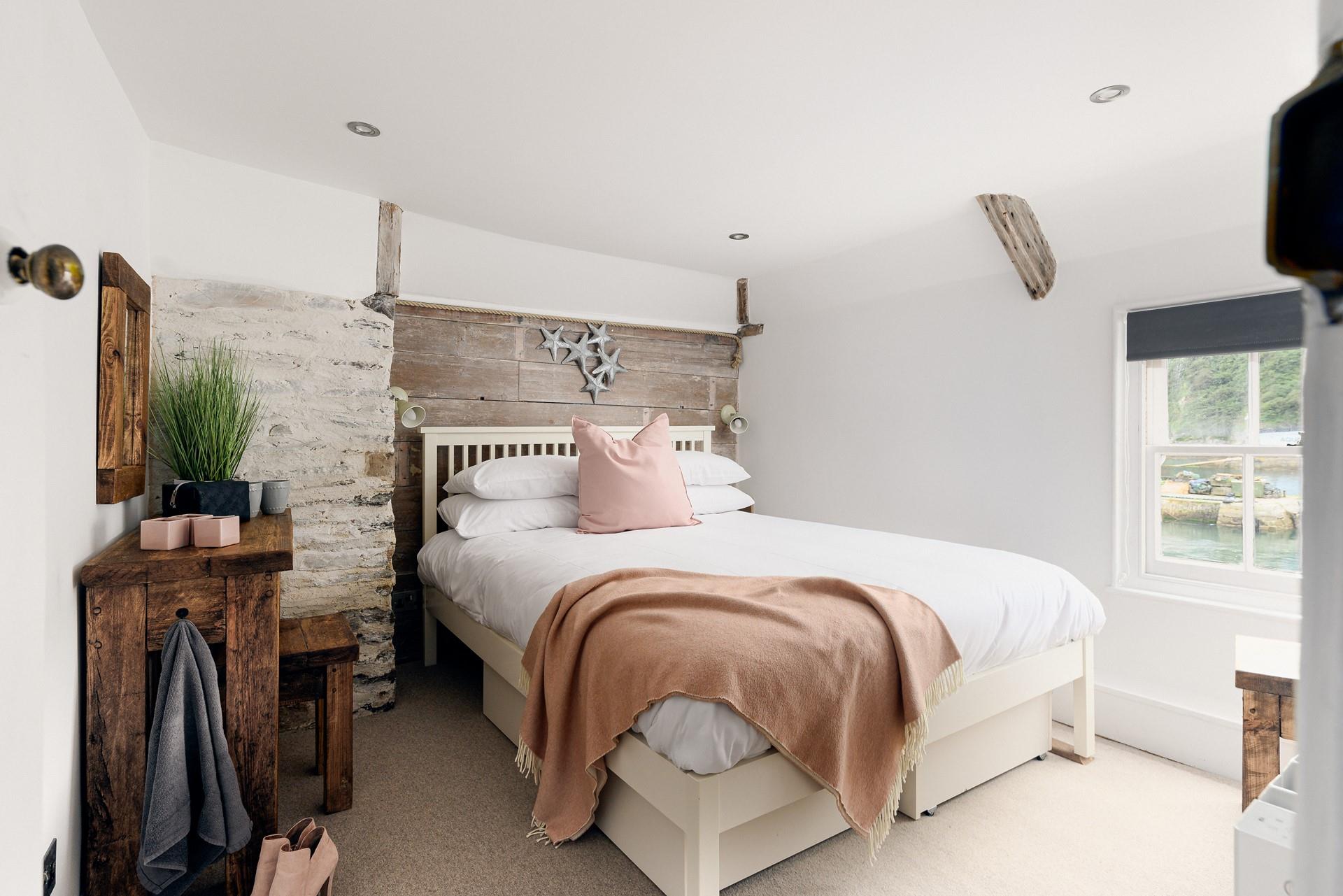 Beautifully rustic, bedroom 1 is a relaxing sanctuary.