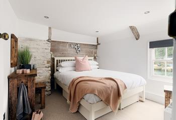 Beautifully rustic, bedroom 1 is a relaxing sanctuary.