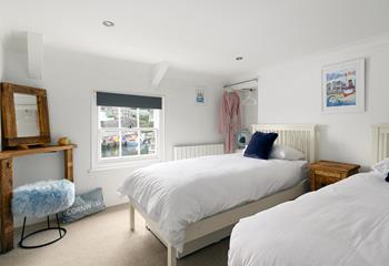 Bedroom 2 is a stylish twin for adults or children with idyllic harbour views.