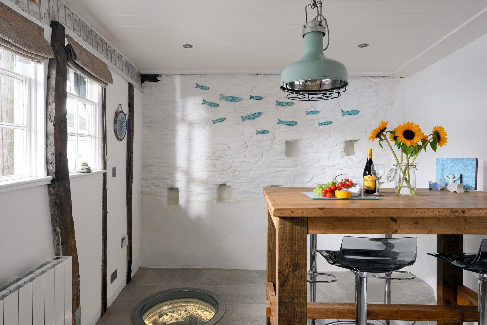 Coastal furnishings reflect the harbourside location.