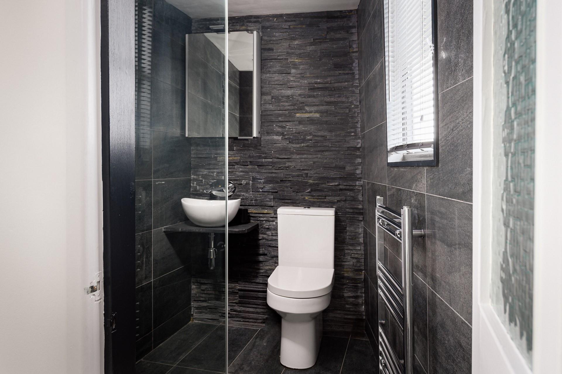 The contemporary walk-in shower is perfect for rinsing sandy toes.