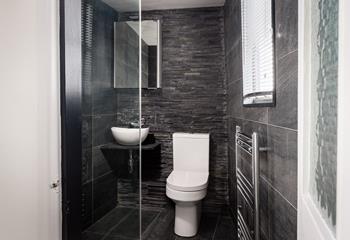 The contemporary walk-in shower is perfect for rinsing sandy toes.