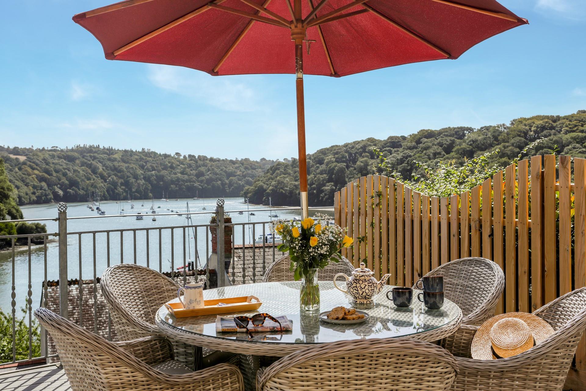 The river glistens in the summer sunshine as you sip an ice-cold cocktail.