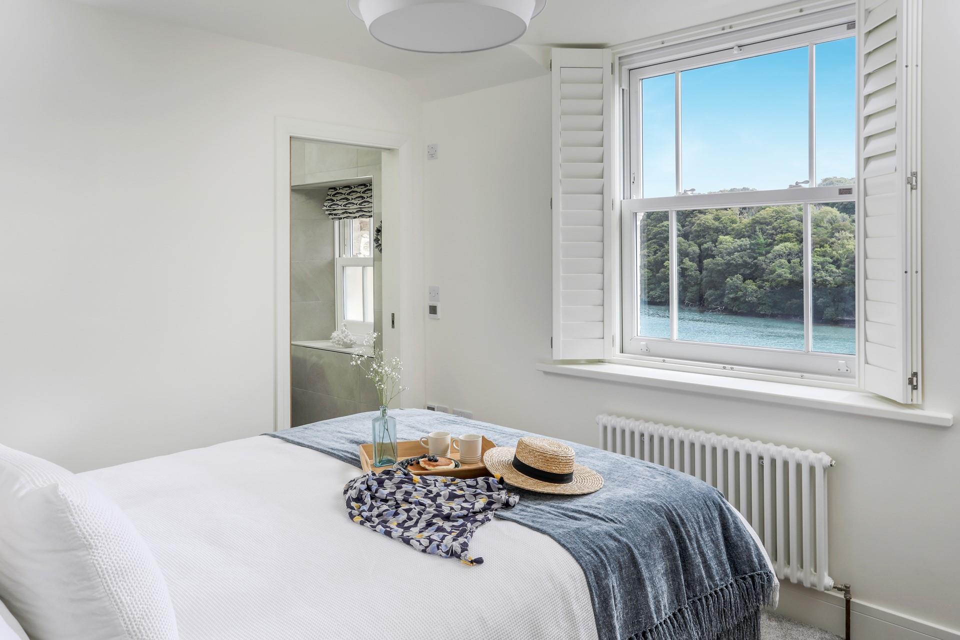 Wake up and open the shutters to enjoy the sun rising over the river in the morning.