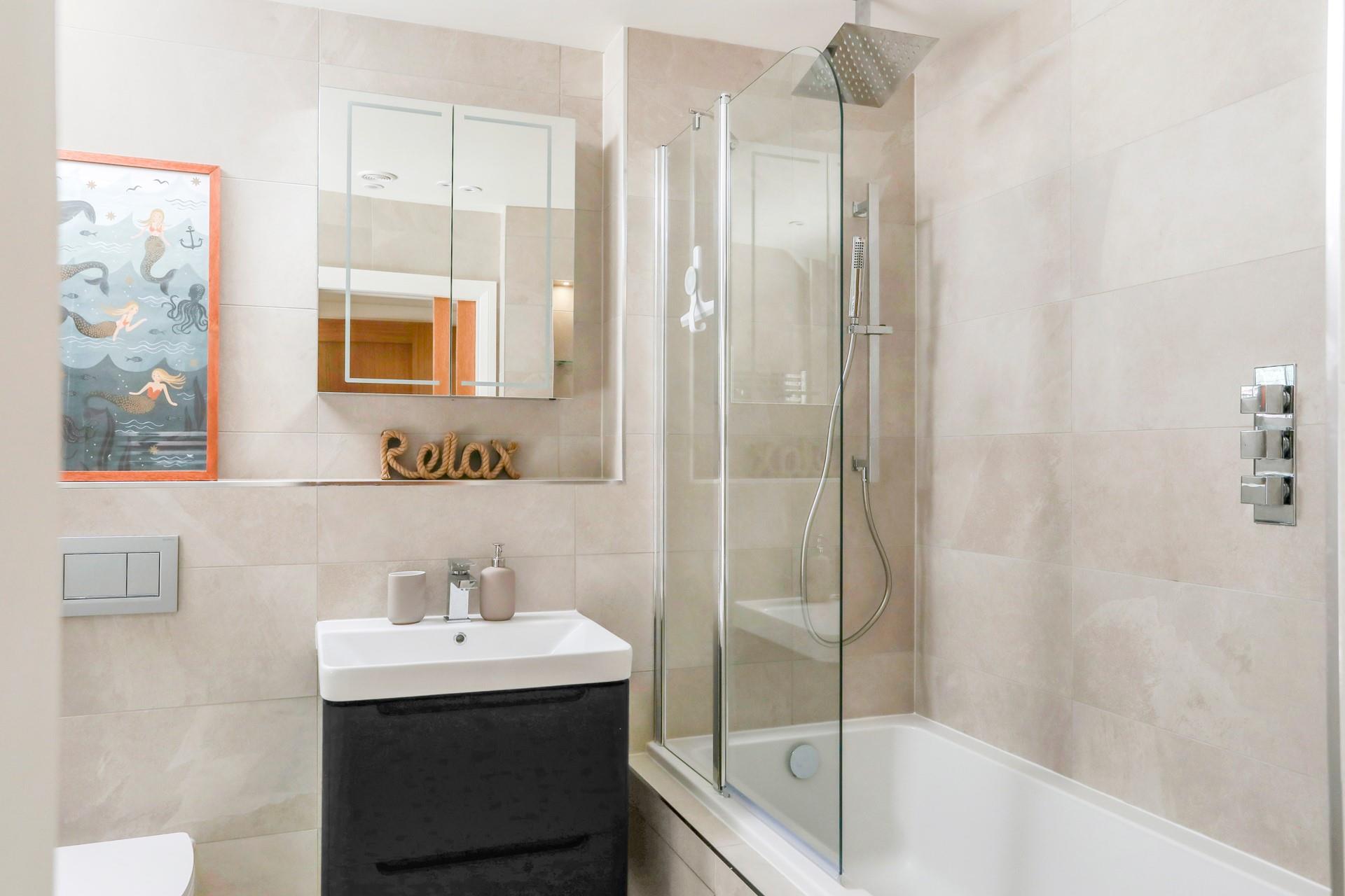 Choose between the luxurious rain-head shower or a bubbly bath.