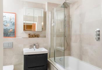 Choose between the luxurious rain-head shower or a bubbly bath.
