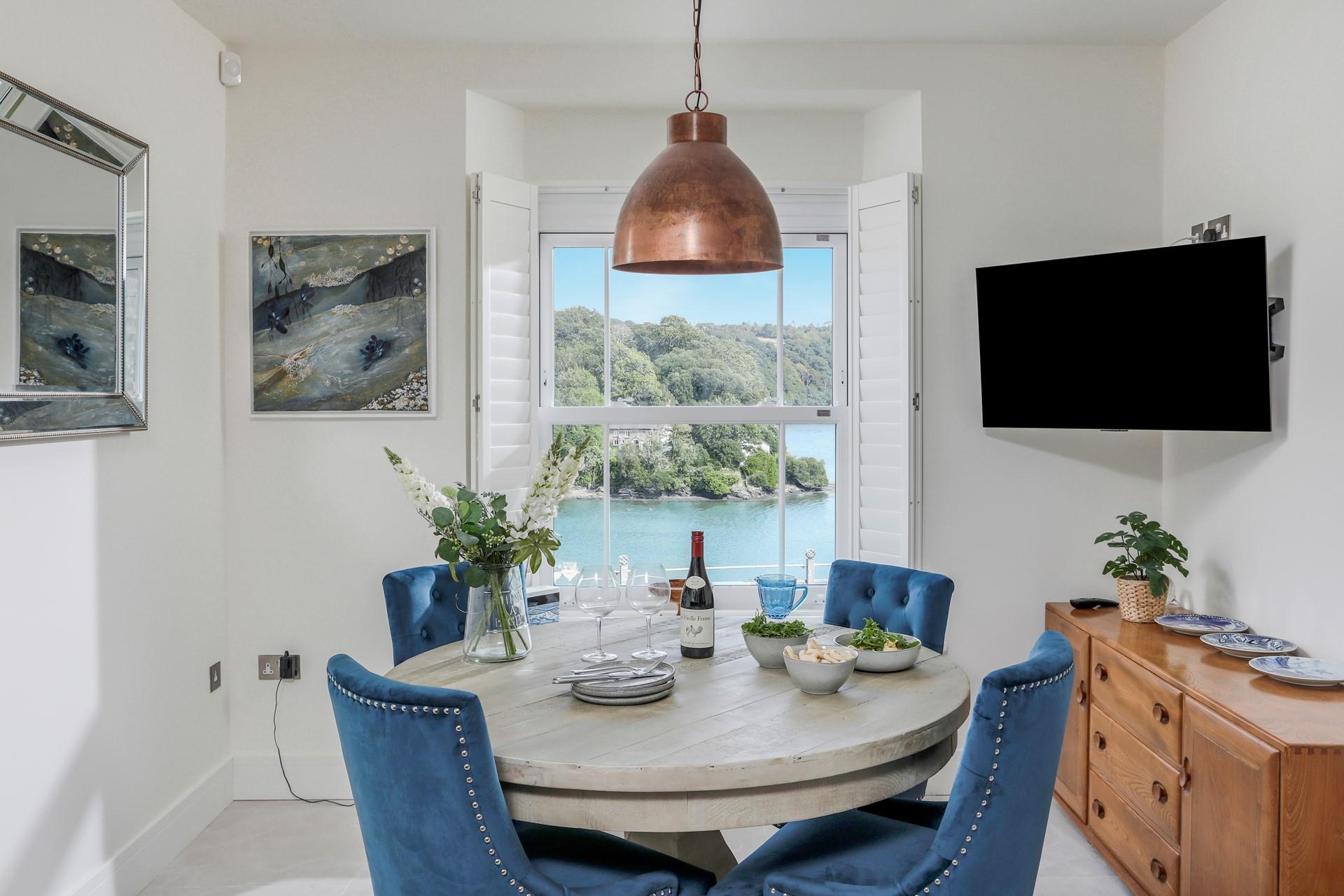 Sit around the table and enjoy a delicious meal with a view.