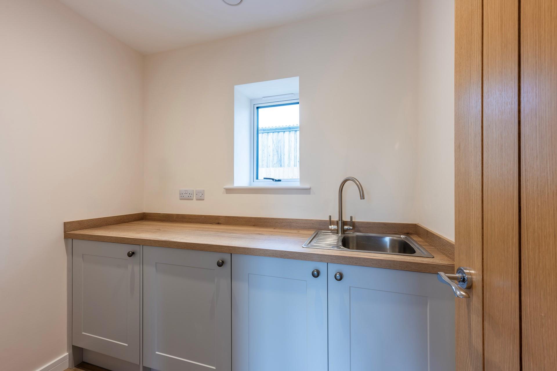 The utility room has a washer/dryer perfect for washing beach clothes.