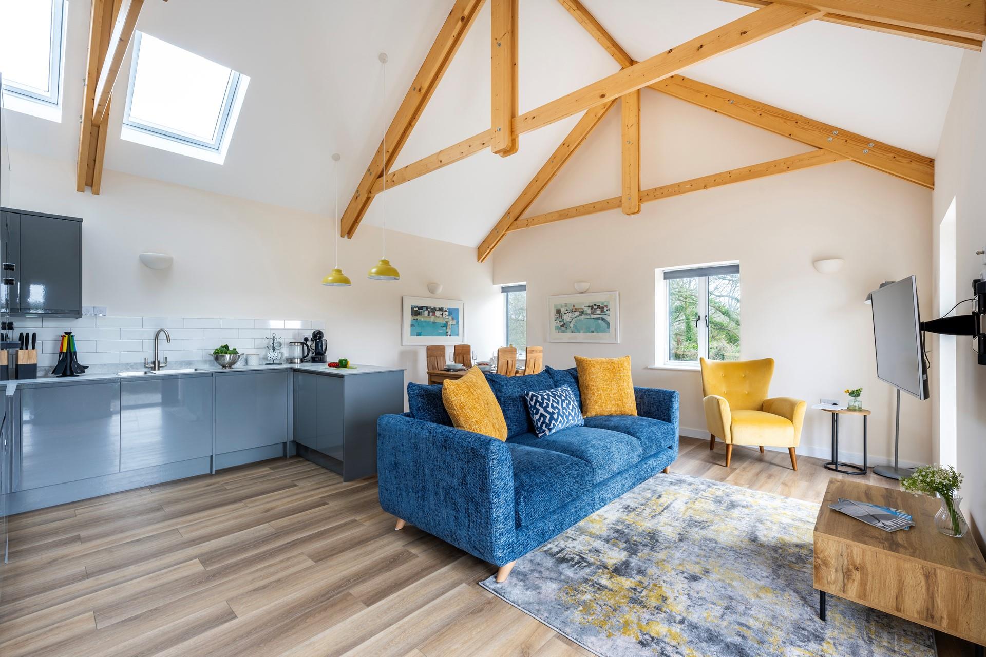 Stylish and comfortable furnishings fill the open-plan living space.