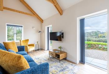 Enjoy leafy countryside views from the plush sofas.
