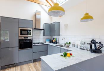 The modern kitchen is perfect for cooking up a storm at mealtimes.
