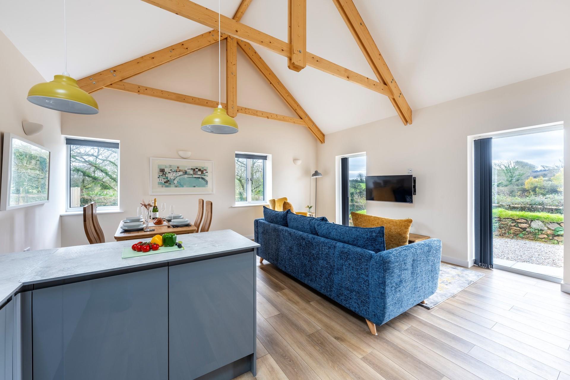 This delightful barn conversion retains quirky features such as the wooden beams.
