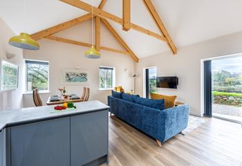 This delightful barn conversion retains quirky features such as the wooden beams.