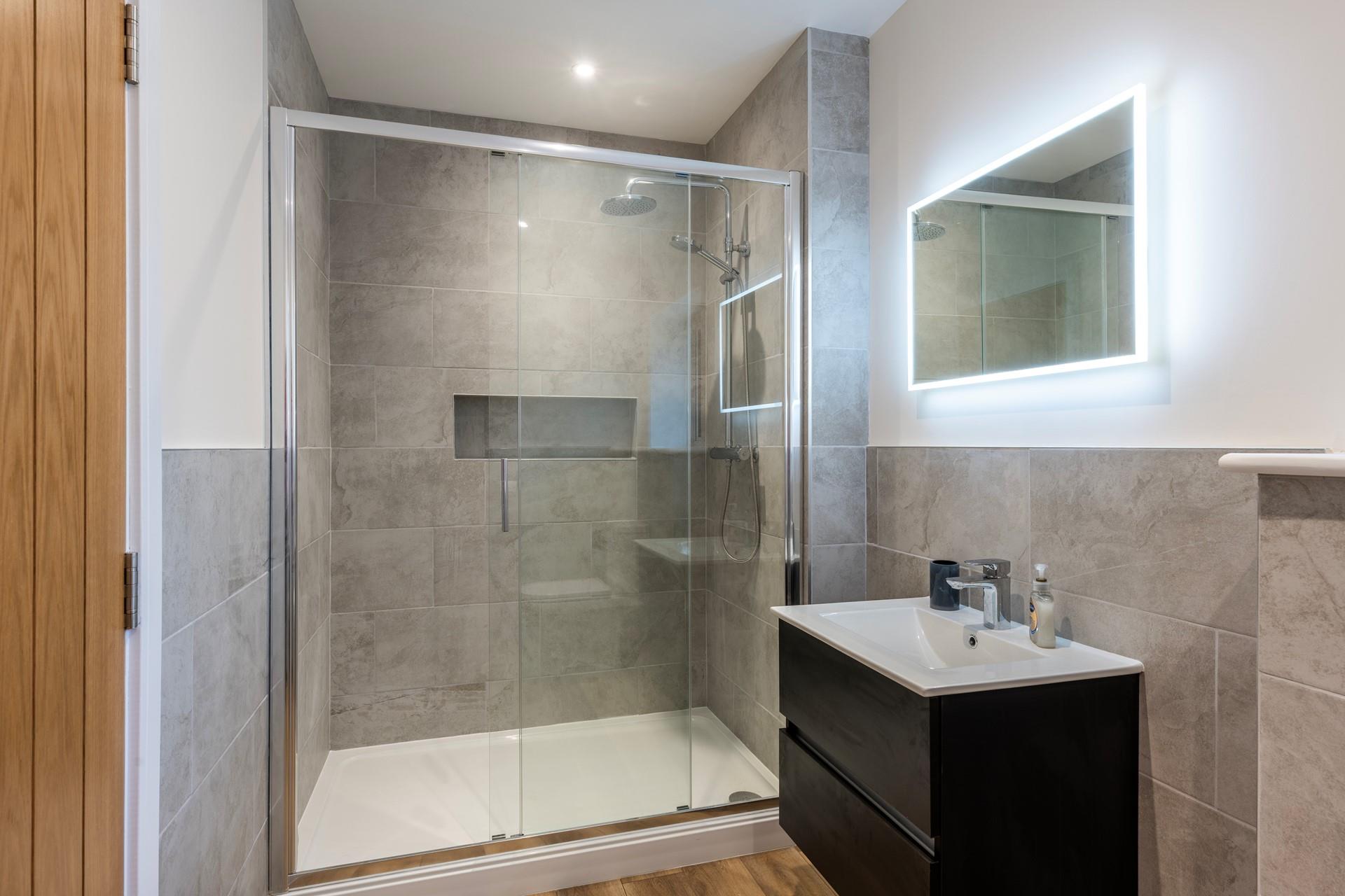 Wash off sandy toes in the shower after a day on the golden sands at Carbis Bay beach.