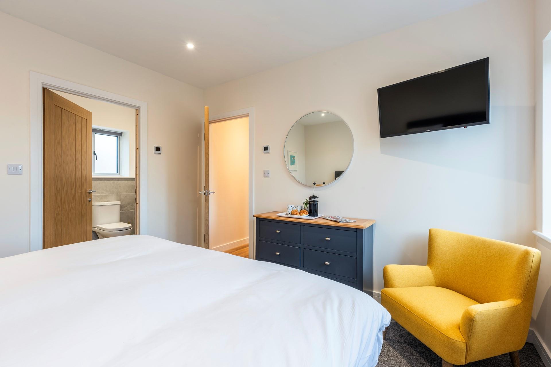 Bedroom 1 benefits from an en suite shower room for getting ready in the morning.