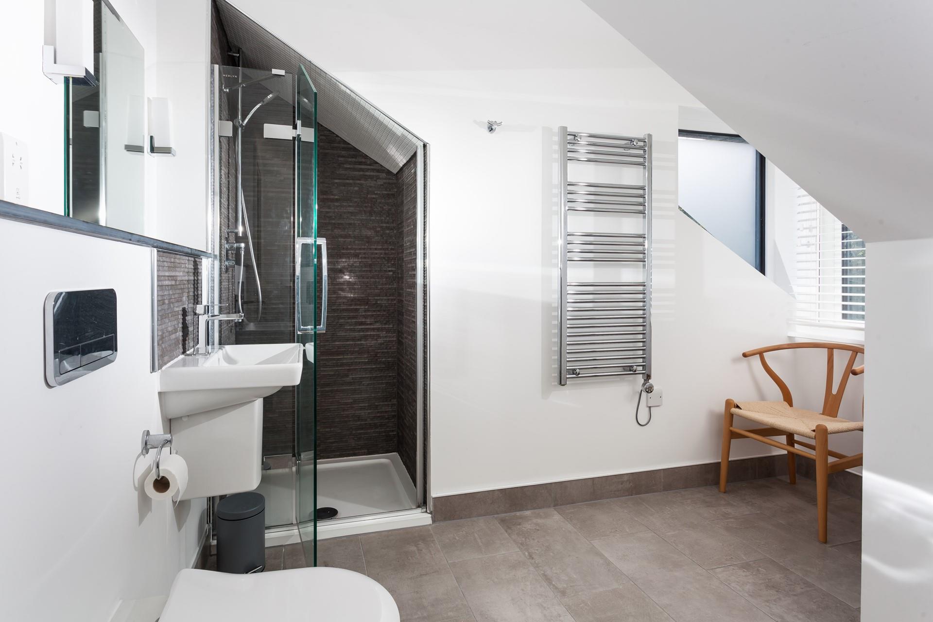 Get ready for the day under the invigorating rainhead shower.