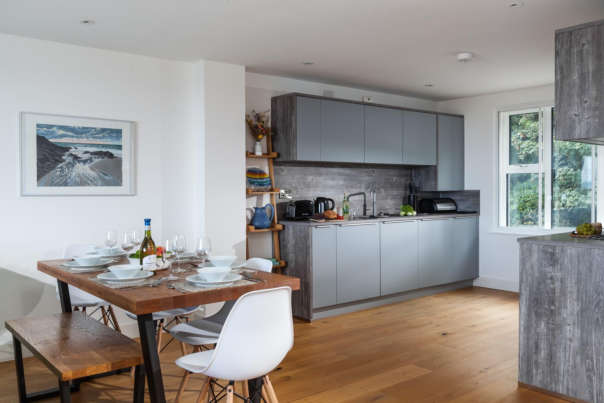 The kitchen is spacious and fully equipped for preparing and cooking meals.