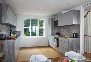 Modern and stylish, the kitchen is a great space to prepare beach picnics or cook delicious dinners.
