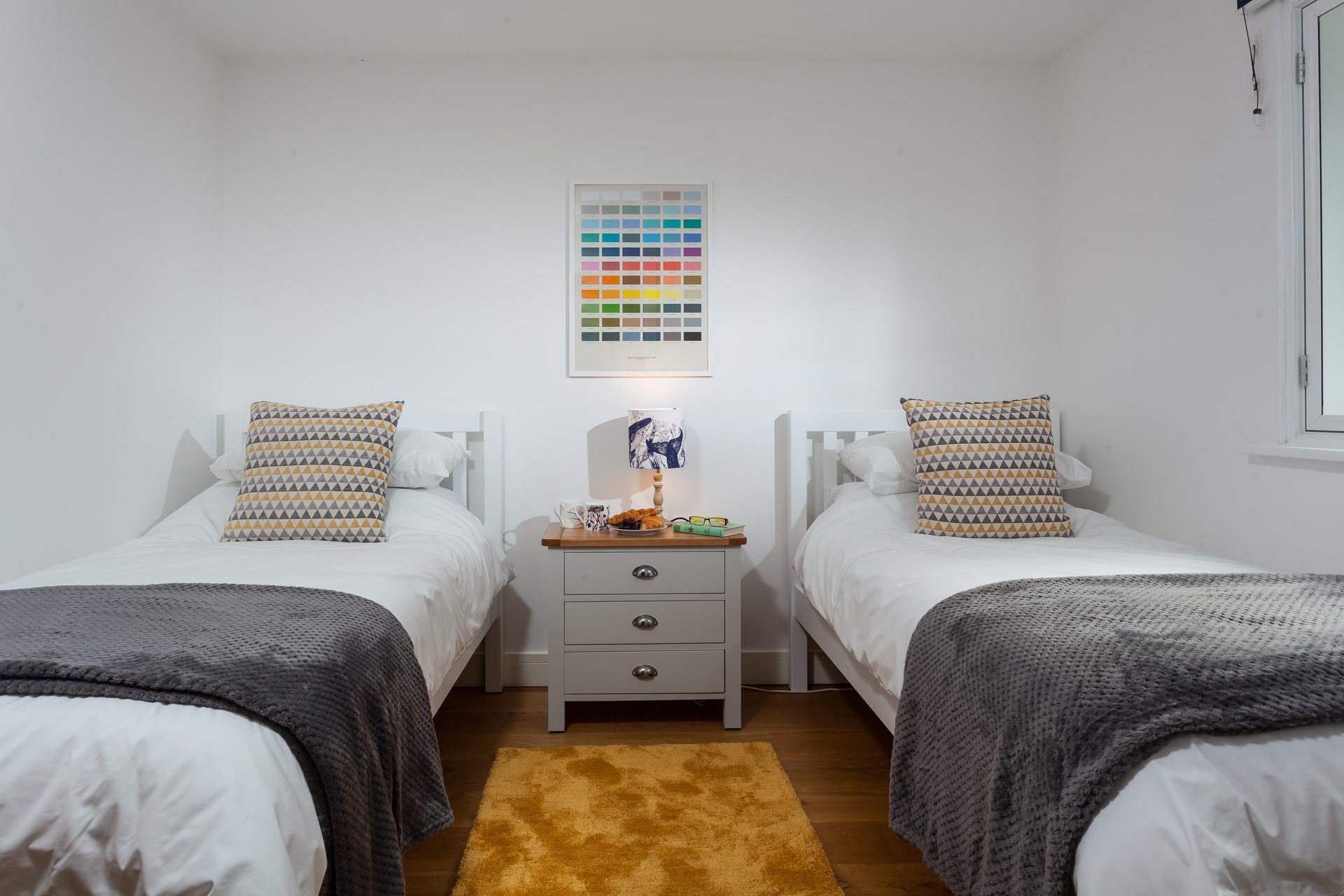 Bedroom 1 has twin beds perfect for young adults or children.