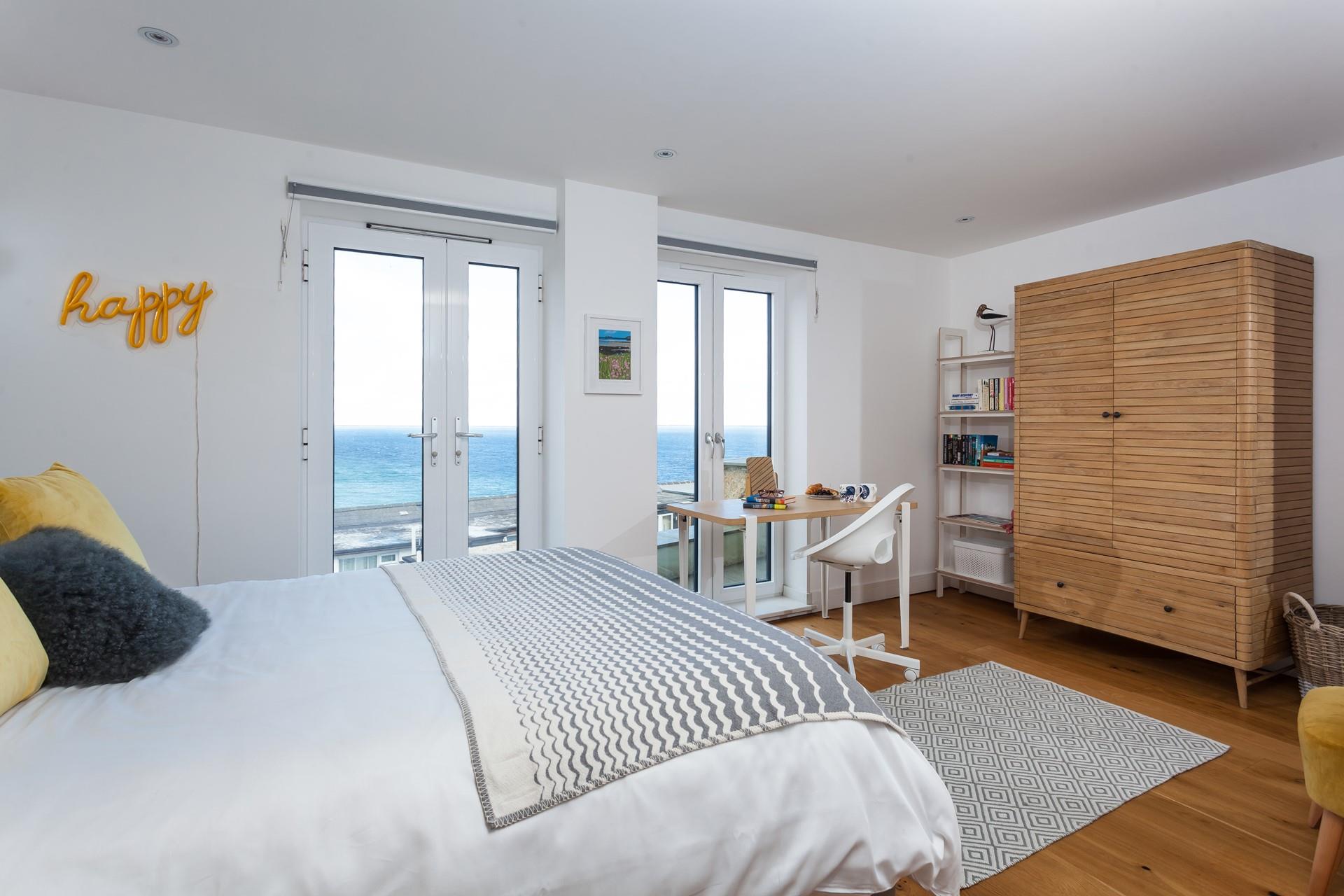 Bedroom 2 has a sumptuous king size bed and desk overlooking the stunning sea views.