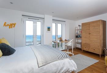 Bedroom 2 has a sumptuous king size bed and desk overlooking the stunning sea views.