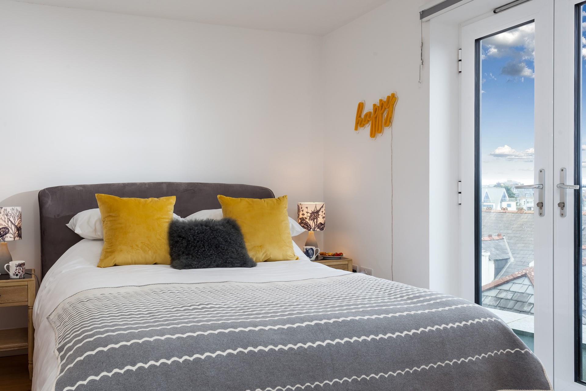 The bedrooms are stylishly decorated with calming seaside tones.