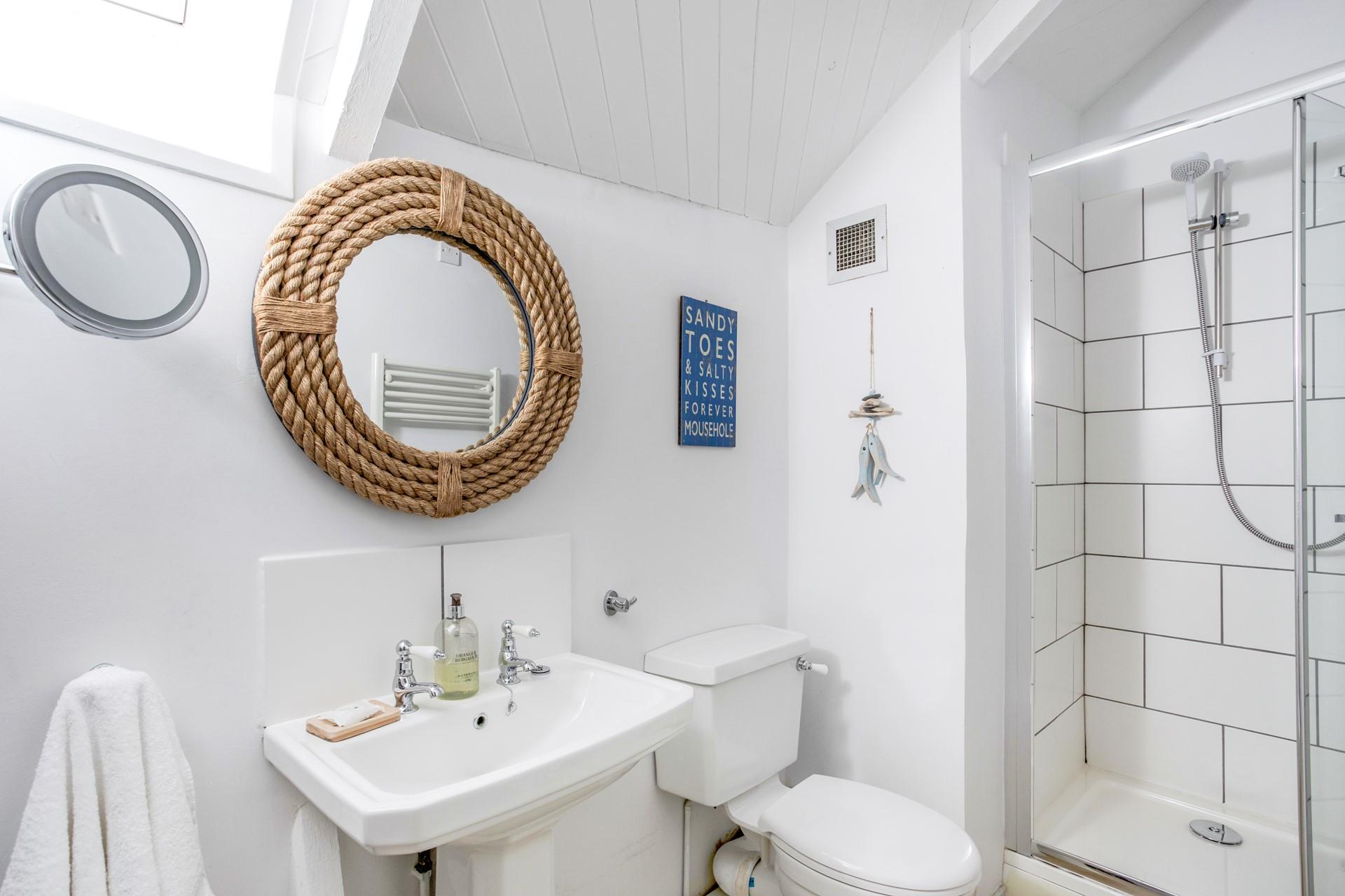 Wash off sandy toes in the shower after spending a day on nearby Porthcurno beach.