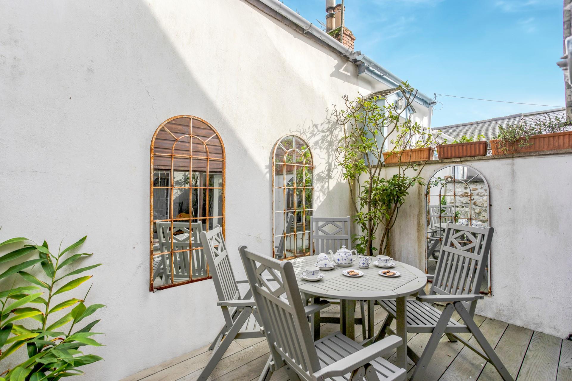 Enjoy tea and cake out in the afternoon sun.