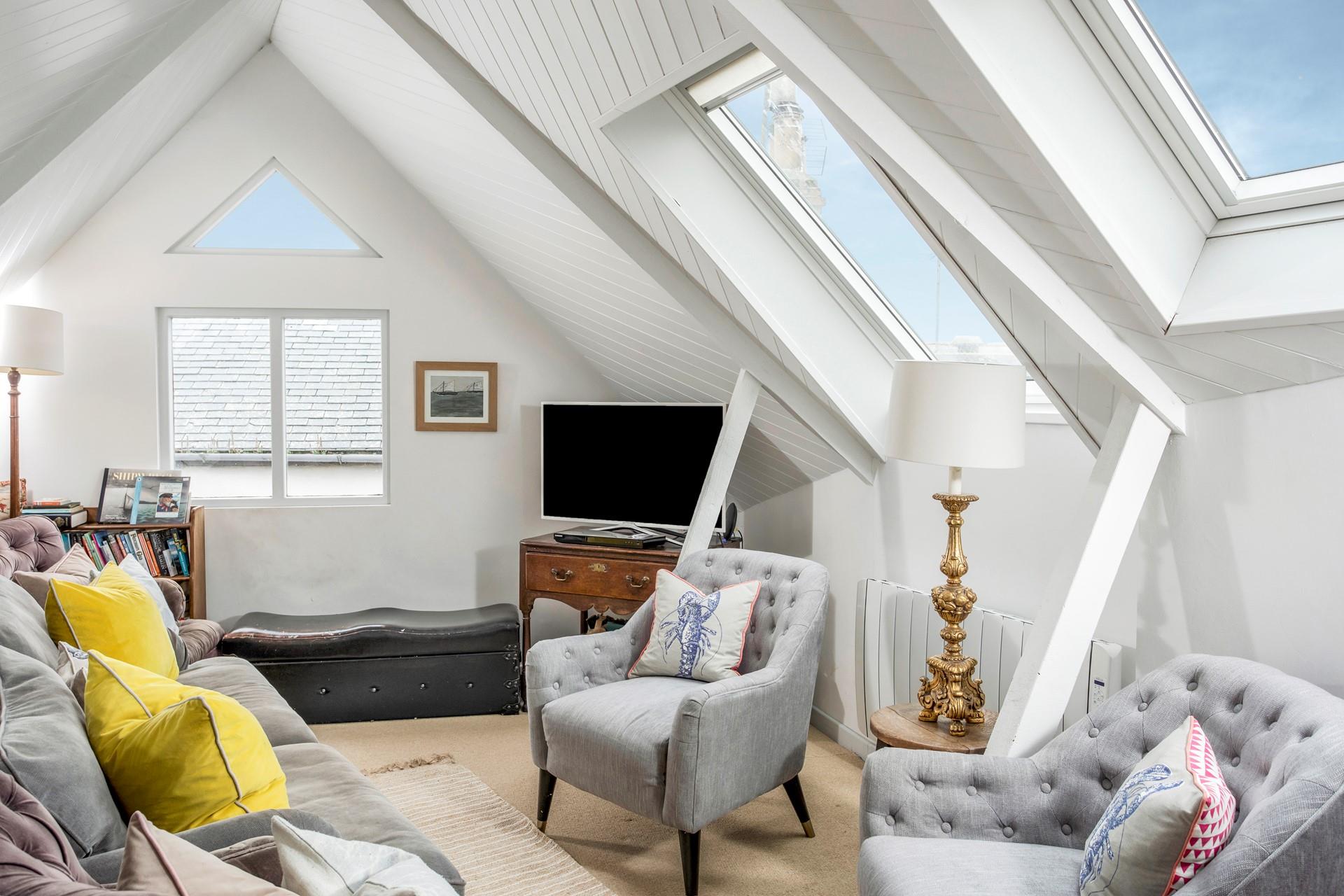 The sitting room is cosy and perfect for a movie night.