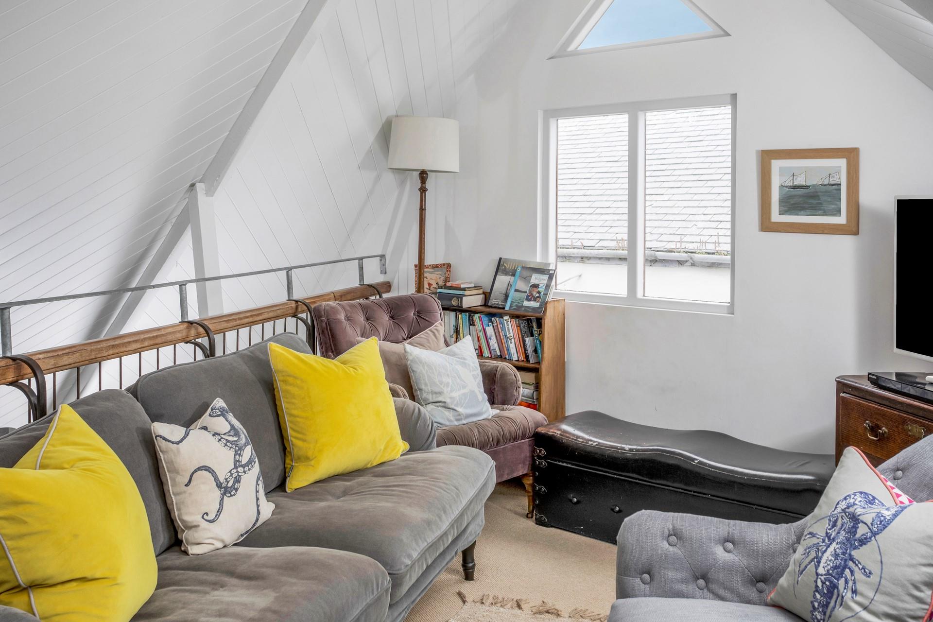 The sitting room is decorated with a nod to the seaside.