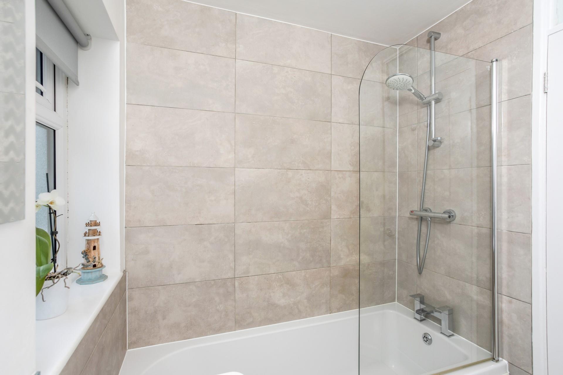 Choose between a shower or bath in the family bathroom.