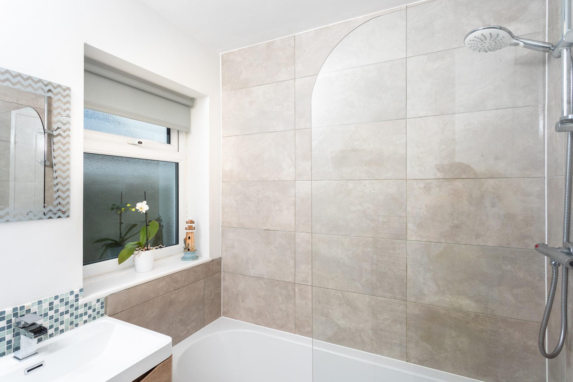 Wash off sandy toes in the shower after a day on Crooklets beach.