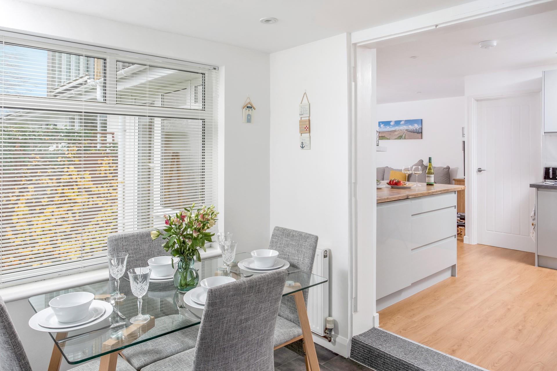 Gather around the stylish dining table and tuck into a feast.