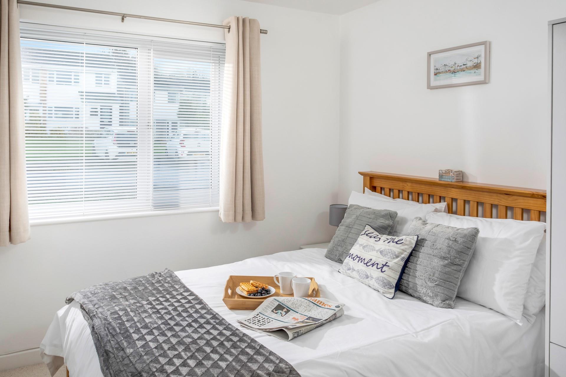 Wake up in the soft sheets of the sumptuous double bed.