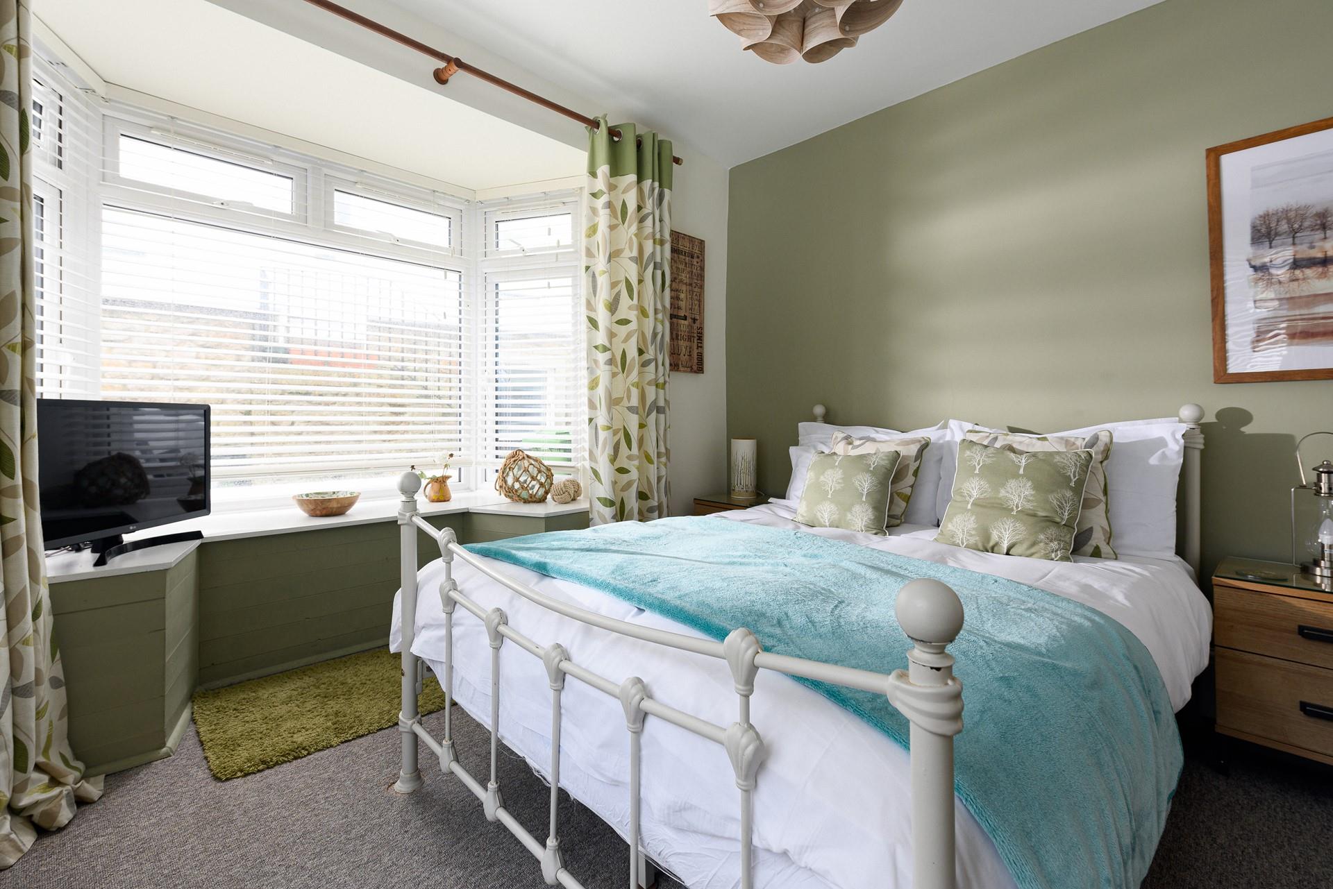 Bedroom 1 has a spacious double bed to tuck into.