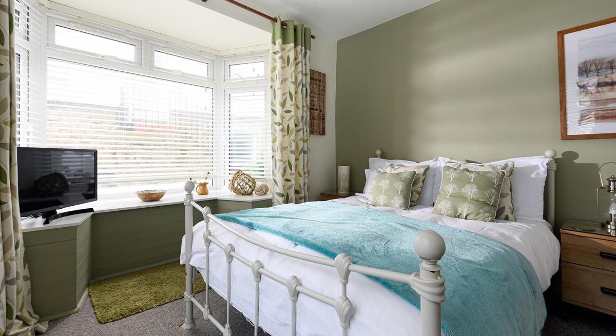 Bedroom 1 has a spacious double bed to tuck into.