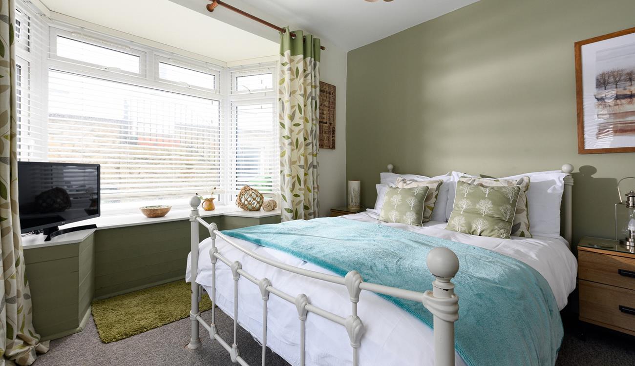 Bedroom 1 has a spacious double bed to tuck into.