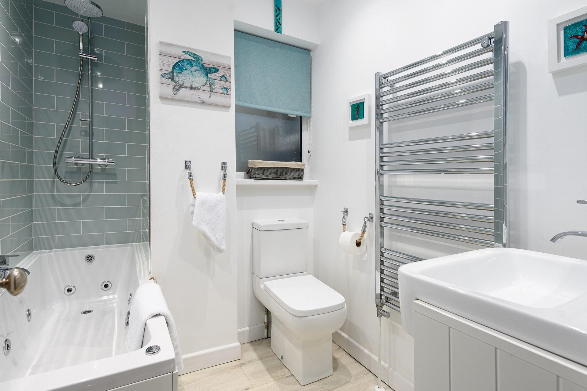 Wash off sandy toes after a day on Porthmeor beach in the modern family bathroom, or indulge in a soak in the jacuzzi bath.