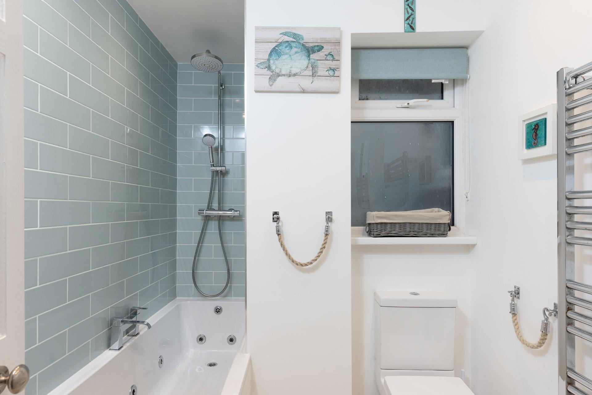 Wash off sandy toes after a day on Porthmeor beach in the modern family bathroom, or indulge in a soak in the jacuzzi bath.